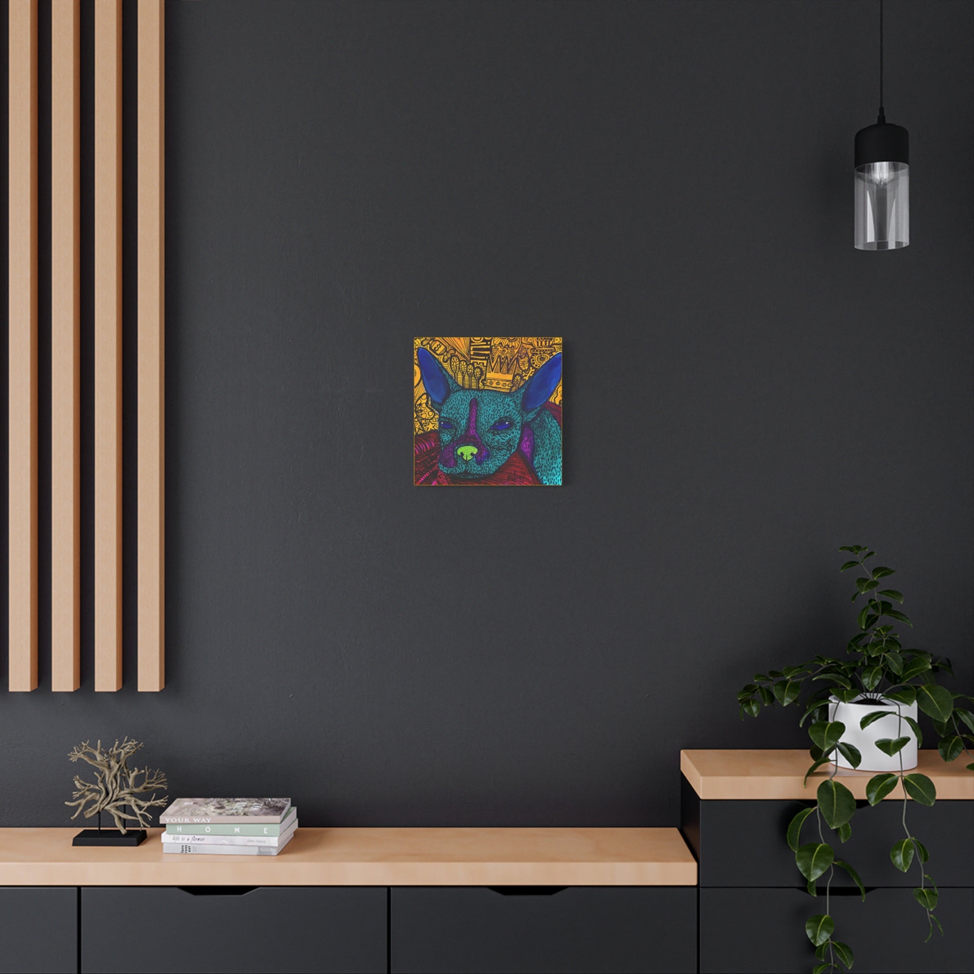 Abstract dog art poster titled 'Billie' by Mathilde Laurendeau, featuring a blue-green dog with purple and green accents against a detailed, patterned yellow background hanging on a black wall of a modern kitchen.